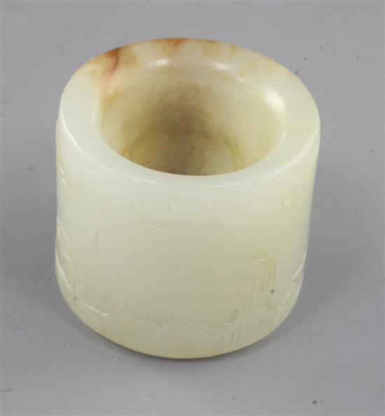 A good Chinese pale celadon and russet jade archers ring, 18th/19th century, height 2.5cm, diameter 2.8cm